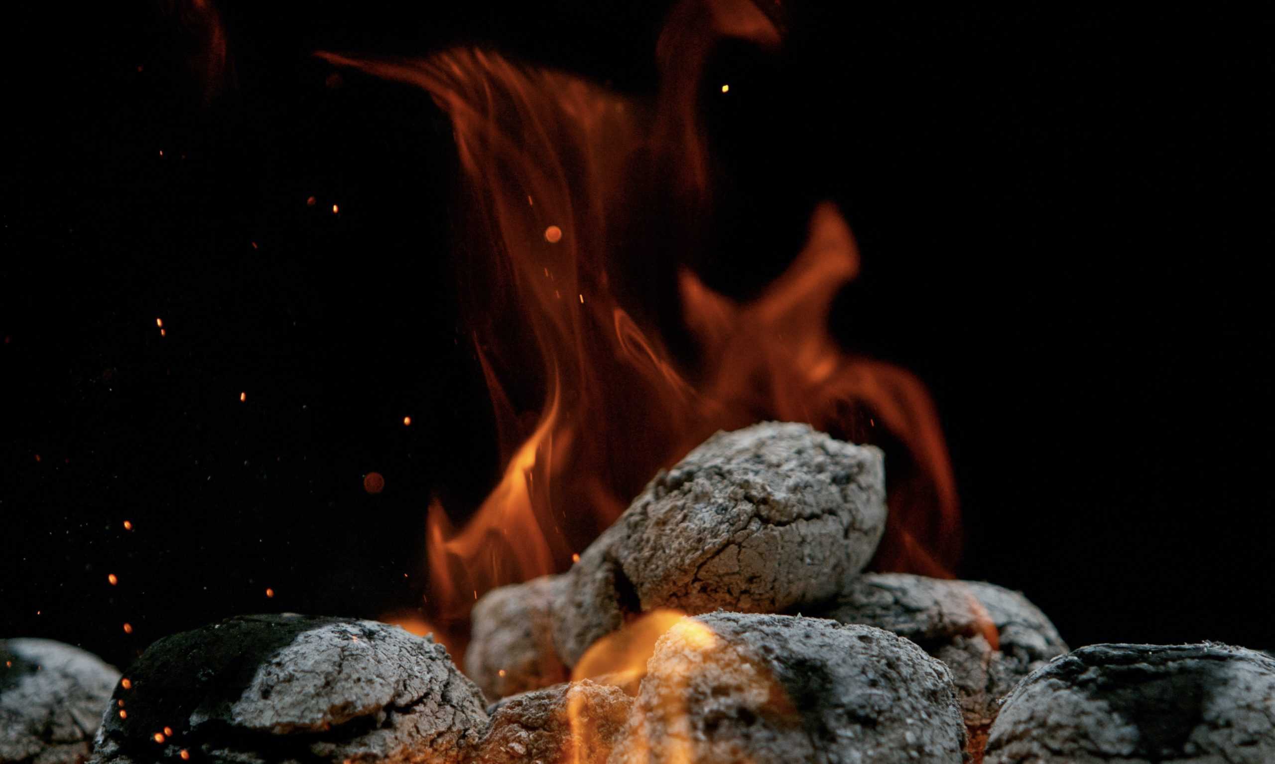 briquettes charcoal burning on a bbq