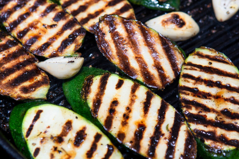 Charred courgette slices with garlic cloves