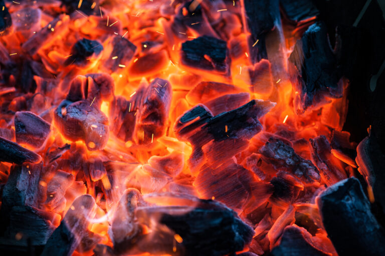 Close-up of barbecue Flaming Charcoal Grill With Bright Flames Of Fire.